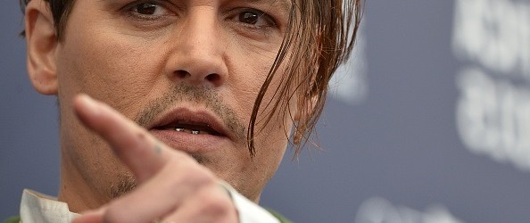 US actor Johnny Depp poses during the photocall of the movie "Black Mass" presented out of competition at the 72nd Venice International Film Festival on September 4, 2015 at Venice Lido.   AFP PHOTO / TIZIANA FABI        (Photo credit should read TIZIANA FABI/AFP/Getty Images)